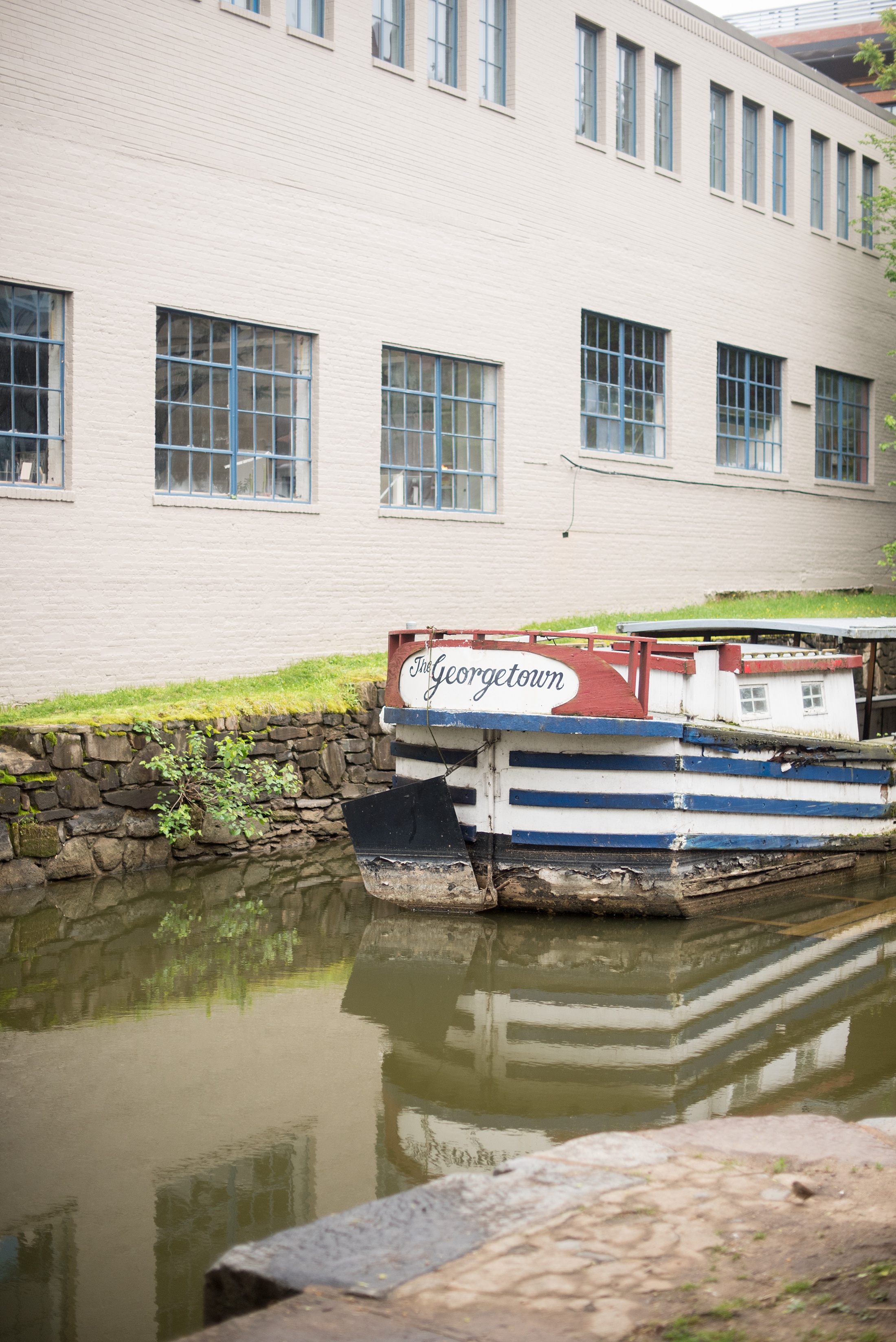 How to Spend One Perfect Day in Washington, DC with a photo of the C and O Canal in Georgetown.